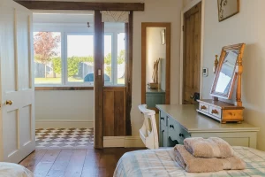 bedroom and hallway looking out to rear garden